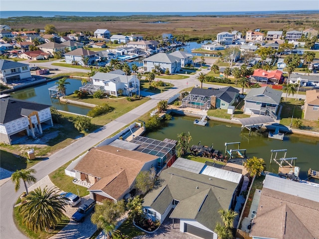 aerial view featuring a residential view and a water view