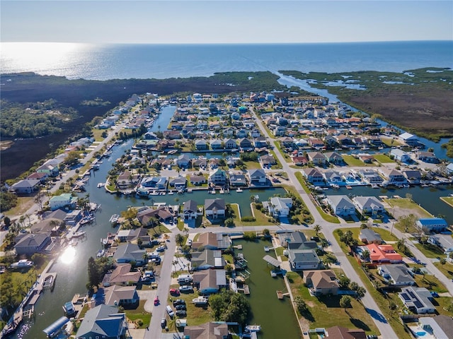 drone / aerial view featuring a residential view and a water view