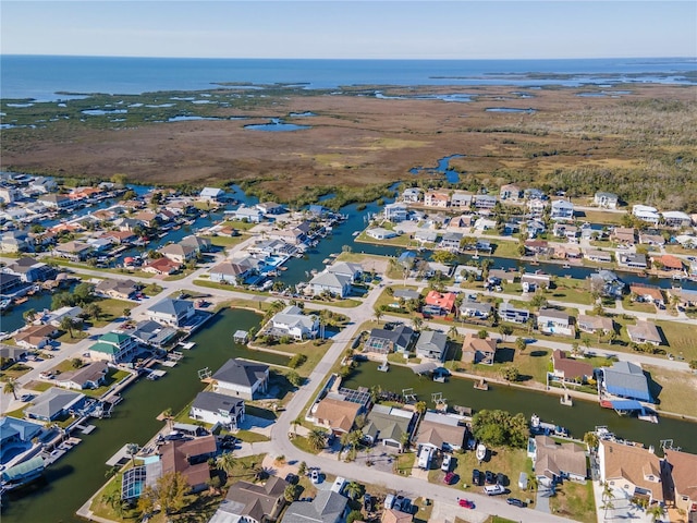 birds eye view of property with a residential view and a water view