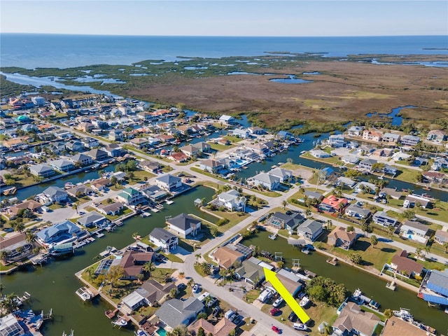 bird's eye view with a residential view and a water view