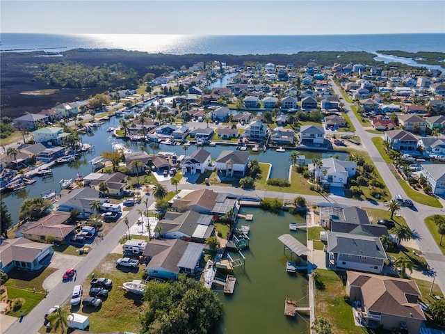 bird's eye view featuring a residential view and a water view