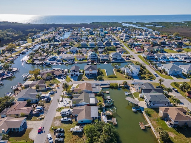 bird's eye view featuring a residential view and a water view