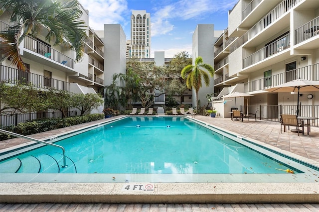 community pool featuring a patio area