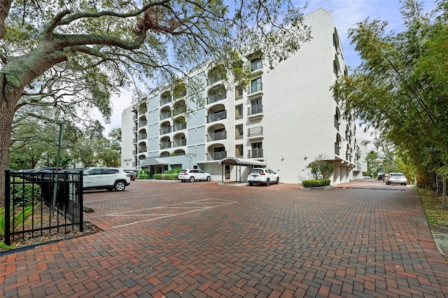 view of property with uncovered parking