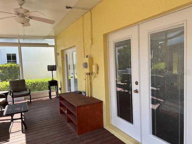 deck with ceiling fan and french doors