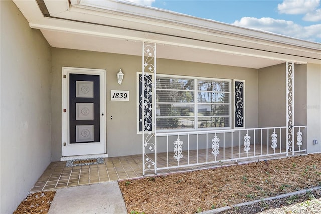 doorway to property with stucco siding