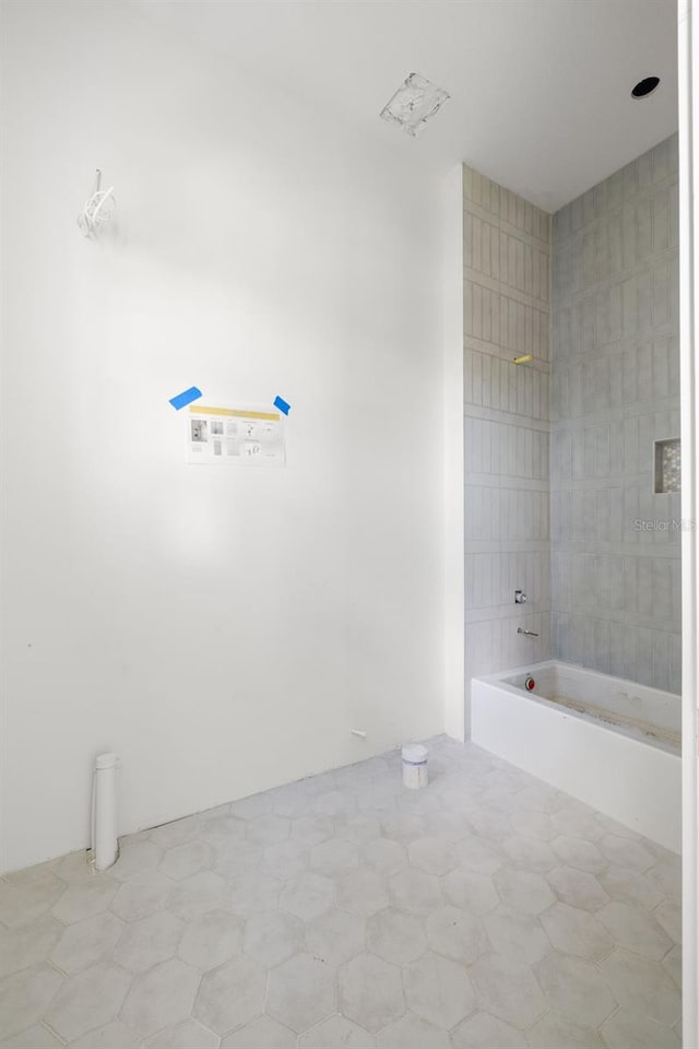 bathroom with bathing tub / shower combination