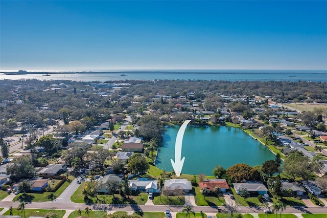 drone / aerial view featuring a water view and a residential view