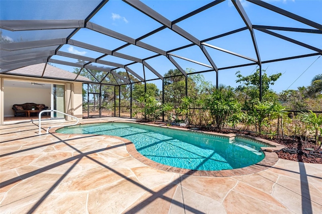 outdoor pool featuring a patio area and a lanai