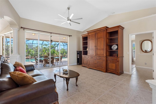 living area with lofted ceiling, ceiling fan, baseboards, and ornate columns