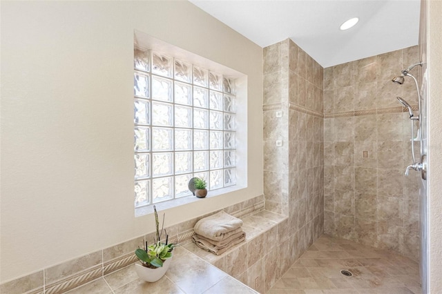 full bath with a tile shower