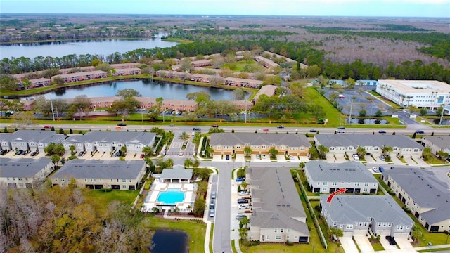 bird's eye view featuring a residential view and a water view