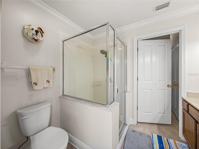 full bathroom featuring ornamental molding, a stall shower, vanity, a textured ceiling, and tile patterned floors