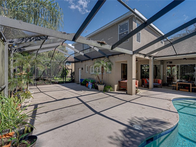 view of patio / terrace featuring ceiling fan, an outdoor hangout area, a lanai, and an outdoor pool