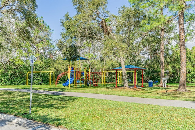 community jungle gym with a yard