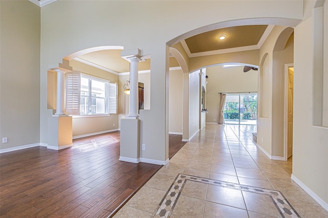 corridor featuring crown molding and baseboards