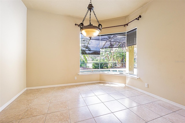 tiled empty room with baseboards