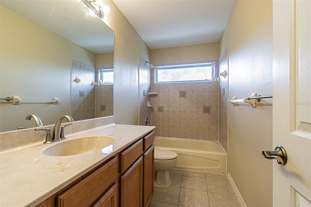 bathroom with a textured ceiling, toilet, vanity, baseboards, and tile patterned floors