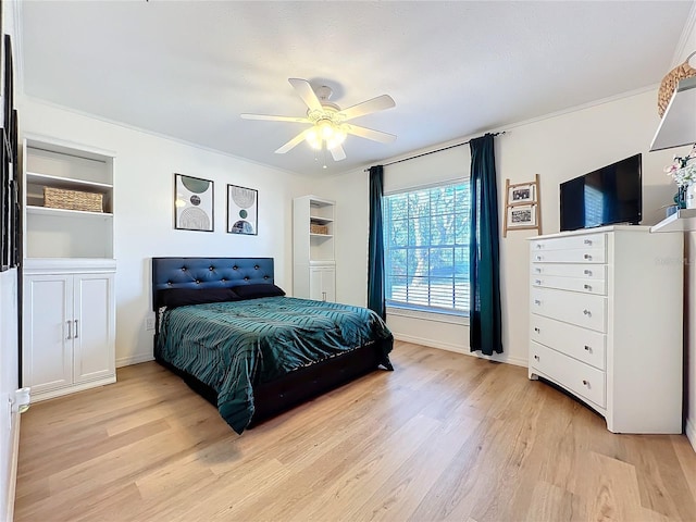 bedroom featuring light wood-type flooring, a ceiling fan, and baseboards