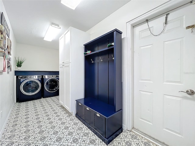 mudroom featuring separate washer and dryer and baseboards