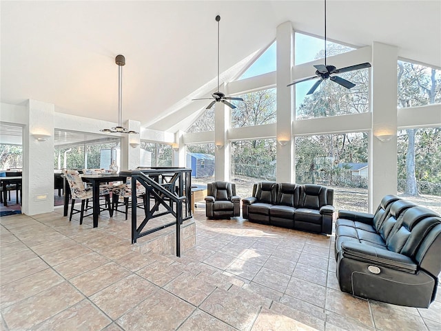 living room with high vaulted ceiling and a ceiling fan