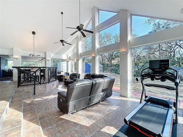 living room featuring a healthy amount of sunlight and stone tile floors