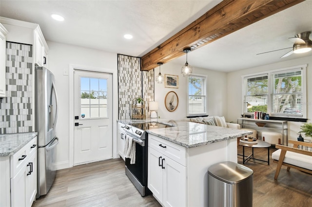 kitchen featuring stainless steel appliances, tasteful backsplash, light wood-style floors, beamed ceiling, and a peninsula