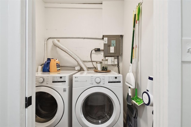 clothes washing area featuring laundry area and separate washer and dryer