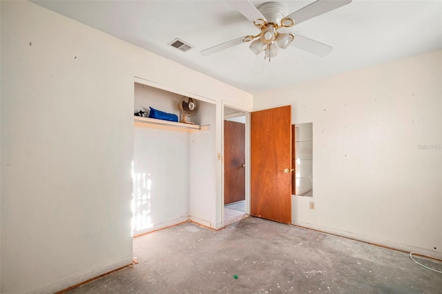 unfurnished bedroom with baseboards, visible vents, unfinished concrete flooring, ceiling fan, and a closet