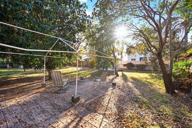 view of yard with a patio area and a fenced backyard