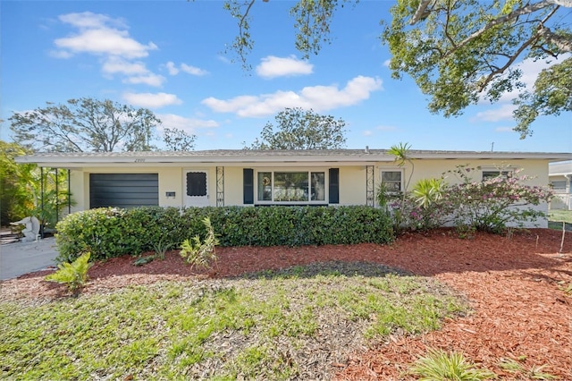 single story home with an attached garage and stucco siding