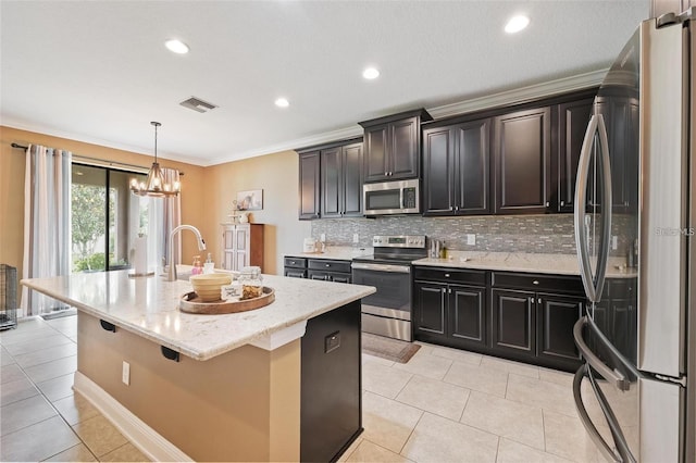 kitchen with light tile patterned floors, visible vents, backsplash, appliances with stainless steel finishes, and a sink