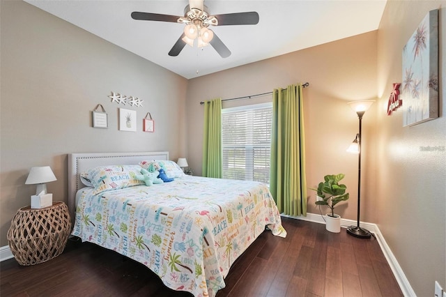 bedroom with wood finished floors, a ceiling fan, and baseboards