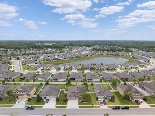 bird's eye view featuring a residential view and a water view