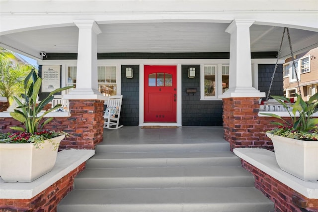 entrance to property featuring a porch