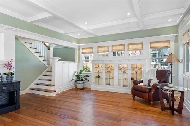 living area with stairway, wood finished floors, coffered ceiling, beam ceiling, and recessed lighting