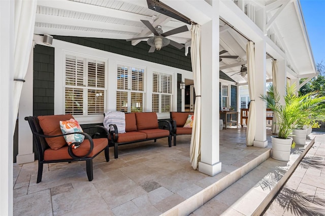 view of patio / terrace with an outdoor living space and ceiling fan