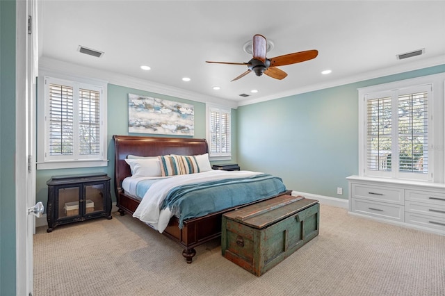 bedroom featuring light colored carpet, visible vents, and ornamental molding