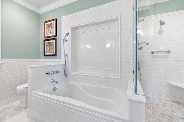 bathroom with a bathing tub, toilet, crown molding, and a tile shower