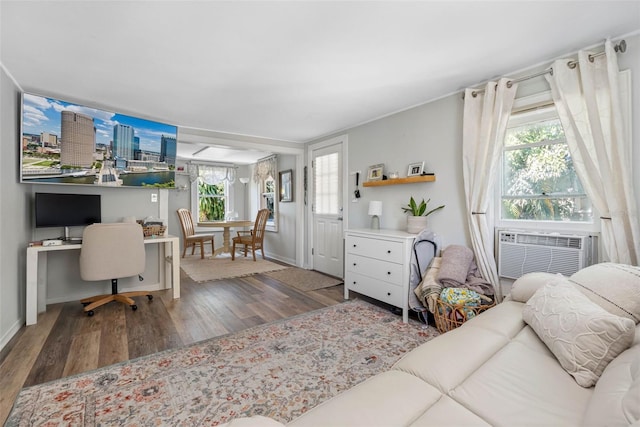 living room featuring wood finished floors and baseboards