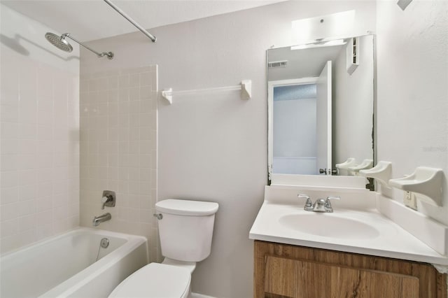 bathroom featuring washtub / shower combination, visible vents, vanity, and toilet