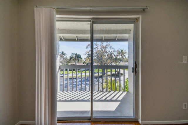 entryway featuring baseboards