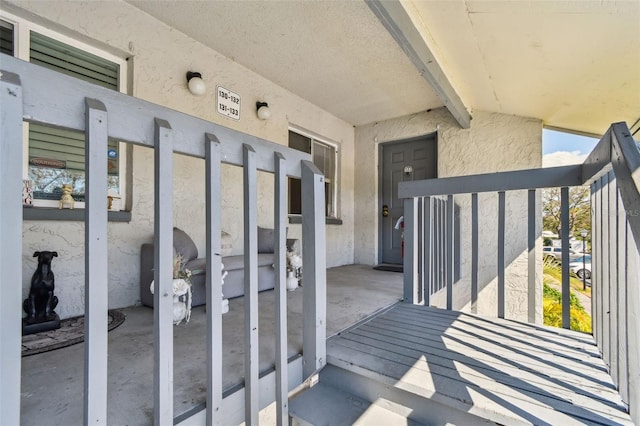 entrance to property with stucco siding