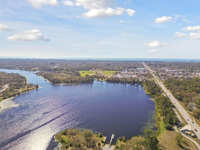 birds eye view of property with a water view