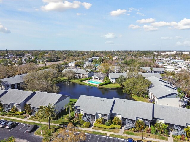 birds eye view of property featuring a water view and a residential view