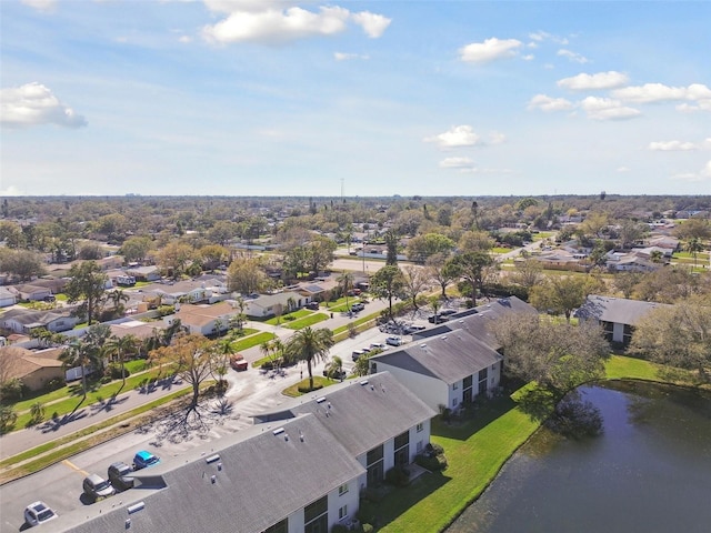 drone / aerial view featuring a water view and a residential view