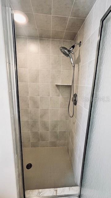 full bathroom with a stall shower