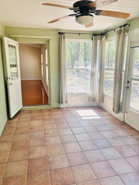 interior space featuring a ceiling fan and light tile patterned floors