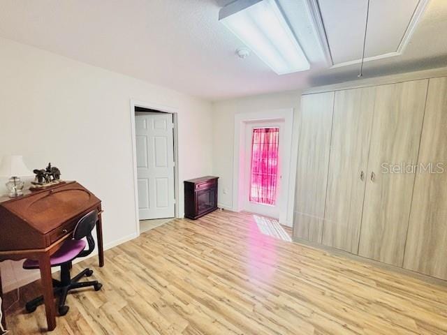 office area with attic access and wood finished floors