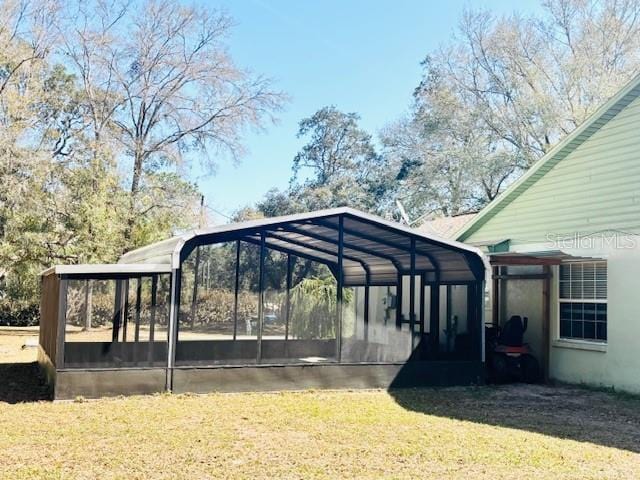 view of parking / parking lot featuring a detached carport and driveway